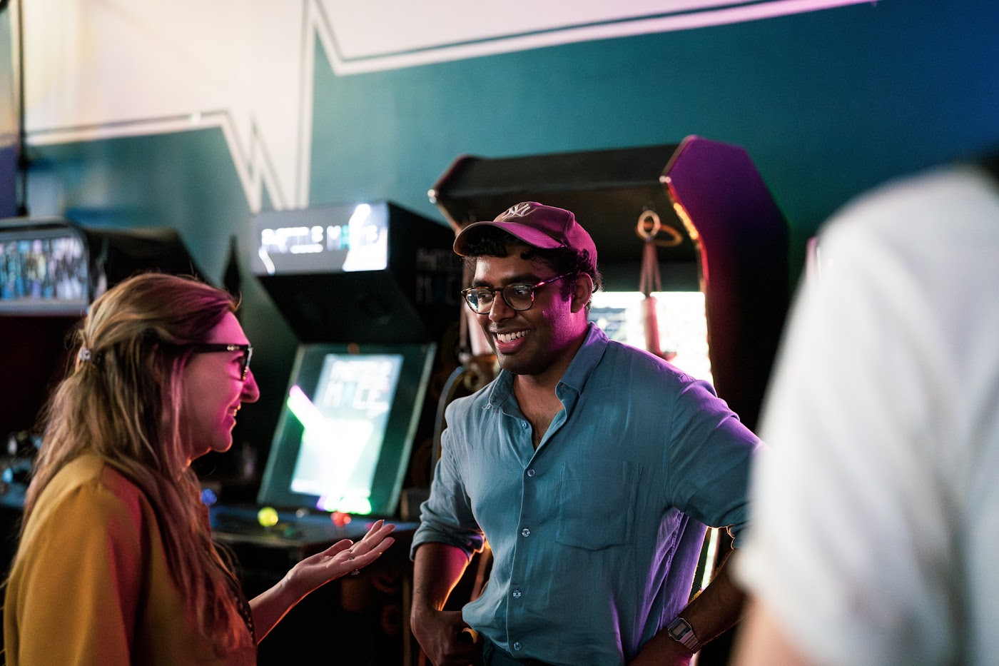 Two meetup guests smiling during a conversation